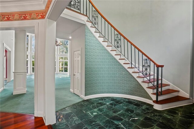 30 River Cypress Ln, Madisonville, LA 70447 - stairs with baseboards, wallpapered walls, and decorative columns