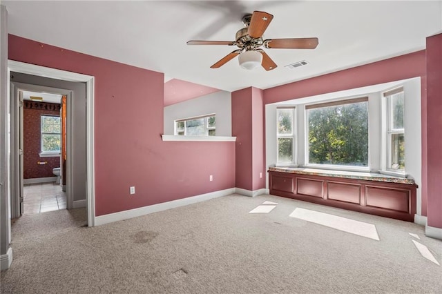 carpeted empty room with ceiling fan