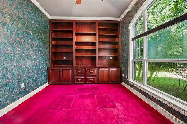 30 River Cypress Ln, Madisonville, LA 70447 - empty room with wallpapered walls, baseboards, dark colored carpet, ornamental molding, and healthy amount of natural light