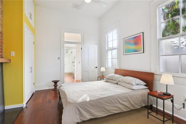 bedroom featuring ceiling fan and dark wood-type flooring