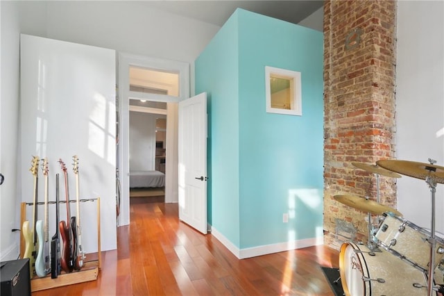 corridor with wood-type flooring