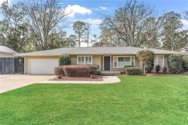 single story home featuring a front lawn, driveway, an attached garage, and fence