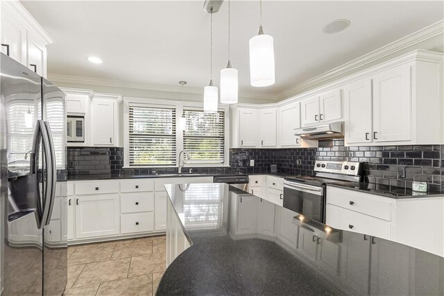 kitchen featuring appliances with stainless steel finishes, white cabinets, sink, backsplash, and light tile patterned flooring