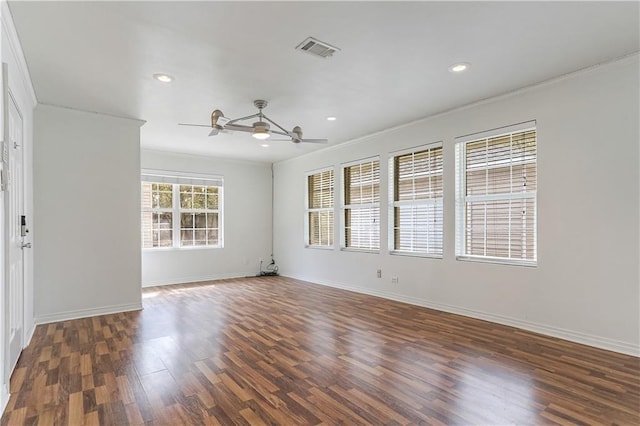 unfurnished room featuring dark hardwood / wood-style floors, ceiling fan, and ornamental molding