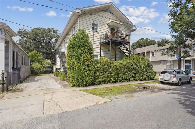 view of front of property with a balcony