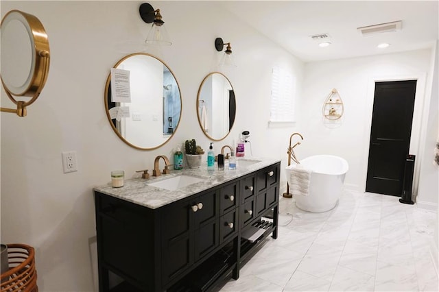 bathroom with vanity and a bathing tub