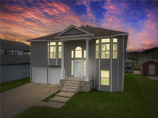 view of front facade featuring a yard and a garage