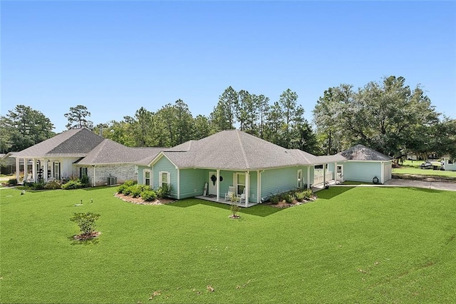 ranch-style house featuring cooling unit, a garage, and a front yard