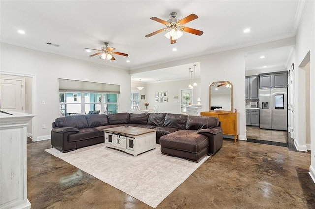 living room featuring ornamental molding, a wealth of natural light, and ceiling fan