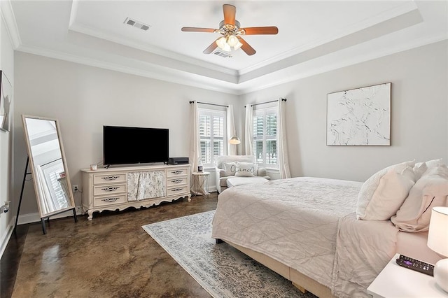 bedroom with ceiling fan, ornamental molding, and a tray ceiling