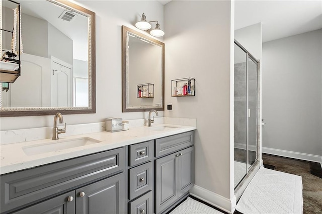 bathroom featuring walk in shower and vanity