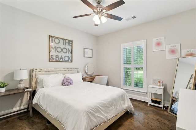 bedroom featuring ceiling fan and dark carpet