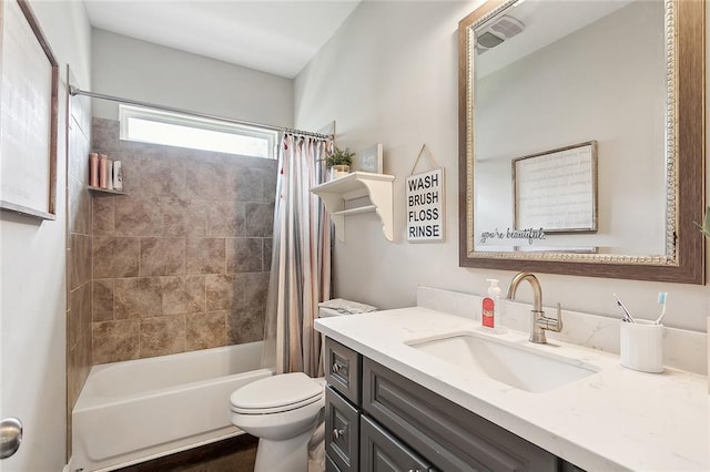 full bathroom featuring shower / bath combination with curtain, vanity, and toilet