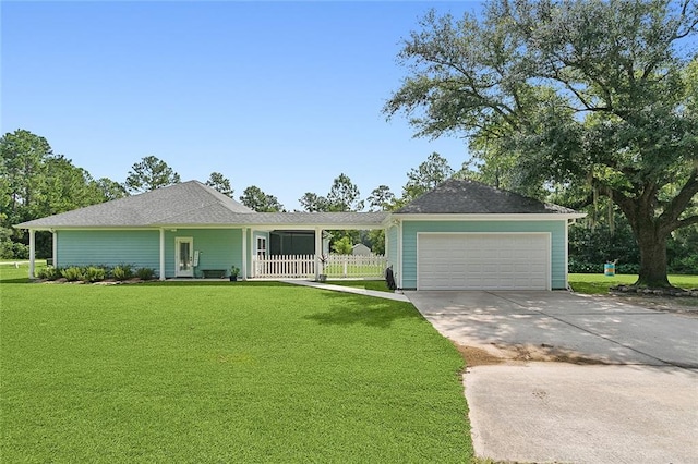 ranch-style home with a garage and a front lawn