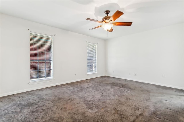 empty room featuring carpet flooring and ceiling fan