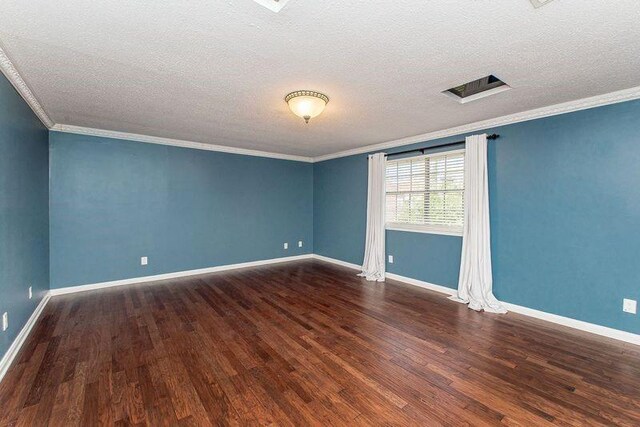 3412 Tolmas Dr, Metairie, LA 70002 - spare room with wood finished floors, ornamental molding, a textured ceiling, and baseboards