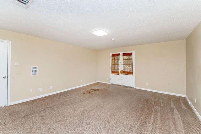3412 Tolmas Dr, Metairie, LA 70002 - carpeted empty room with baseboards and a textured ceiling