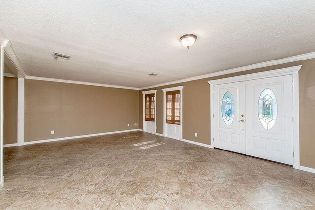 3412 Tolmas Dr, Metairie, LA 70002 - foyer entrance featuring a textured ceiling, baseboards, and ornamental molding