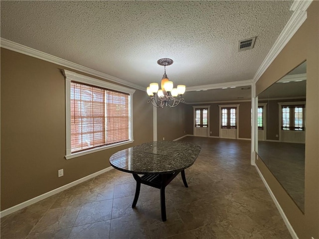 unfurnished dining area featuring crown molding, plenty of natural light, and a chandelier