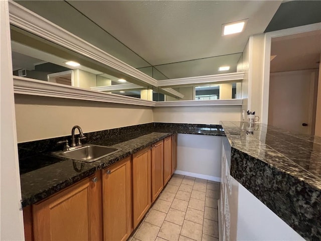 kitchen with sink and light tile patterned floors