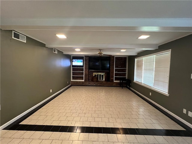 interior space with a fireplace, beam ceiling, and built in features