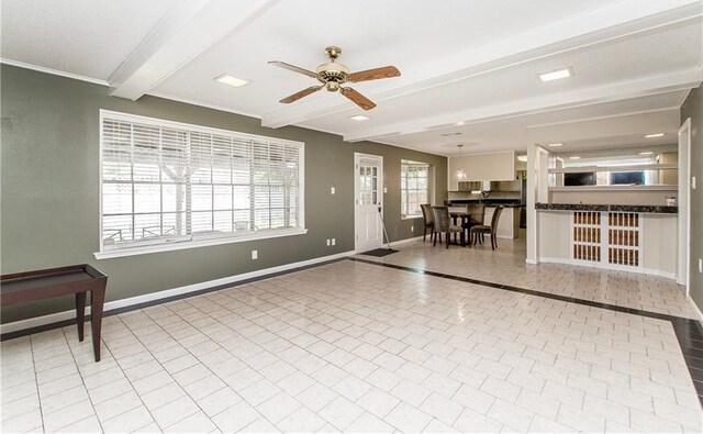 3412 Tolmas Dr, Metairie, LA 70002 - living area featuring beamed ceiling, a ceiling fan, baseboards, and tile patterned flooring