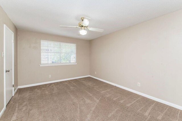 3412 Tolmas Dr, Metairie, LA 70002 - empty room featuring carpet flooring, ceiling fan, and baseboards