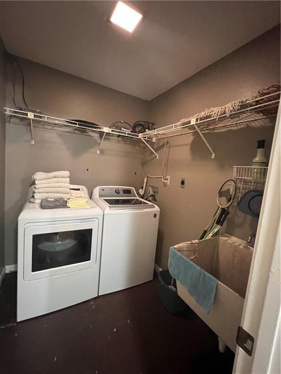 clothes washing area with sink and washing machine and clothes dryer