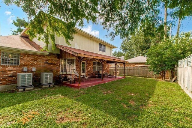 3412 Tolmas Dr, Metairie, LA 70002 - back of property featuring cooling unit and brick siding