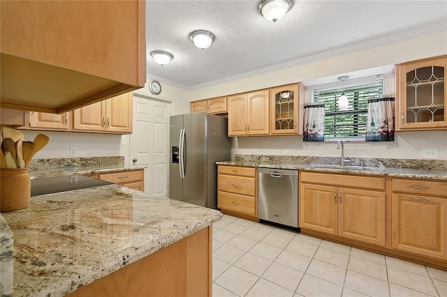 kitchen with sink, stainless steel appliances, ornamental molding, a textured ceiling, and light brown cabinets