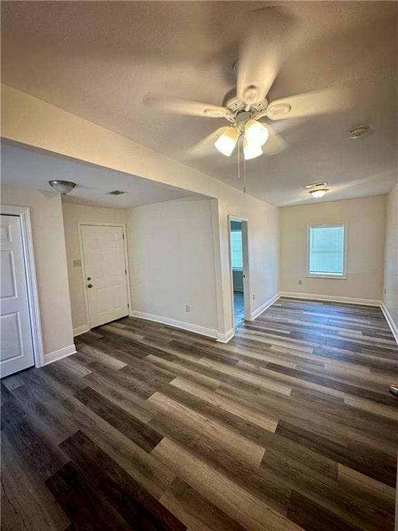 interior space featuring dark hardwood / wood-style flooring and ceiling fan