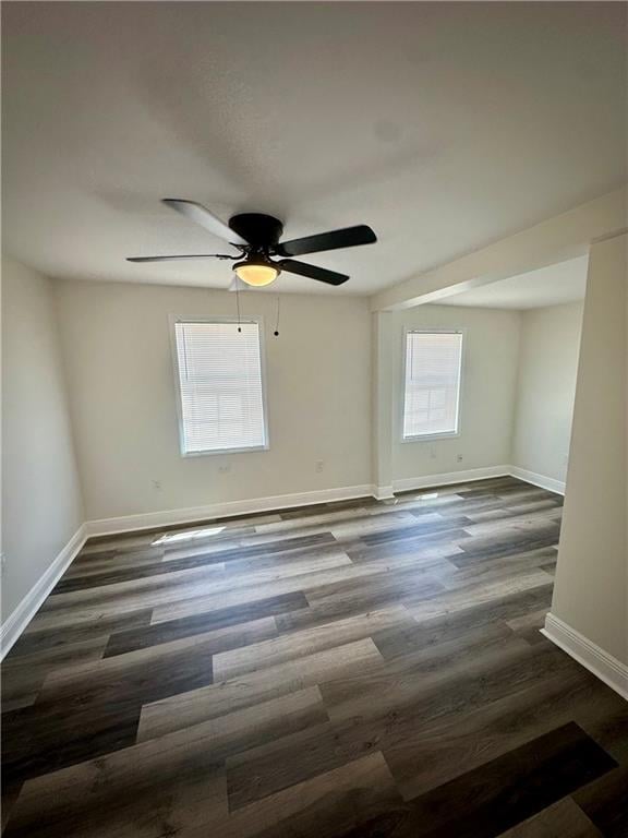 spare room featuring hardwood / wood-style floors and ceiling fan