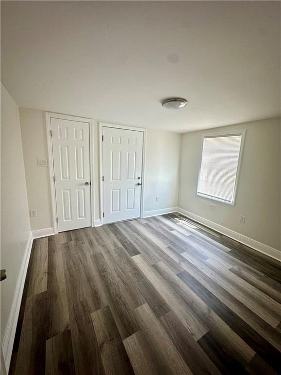 unfurnished bedroom with wood-type flooring