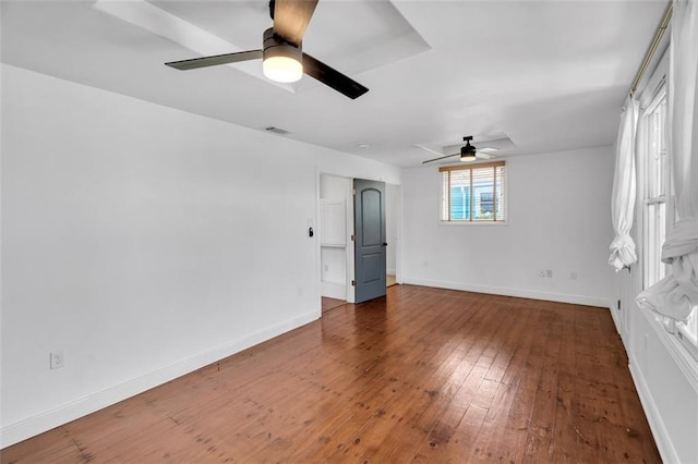 unfurnished room with dark hardwood / wood-style floors and ceiling fan