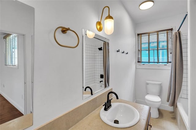 full bathroom with shower / bath combination with curtain, tile patterned floors, vanity, and toilet