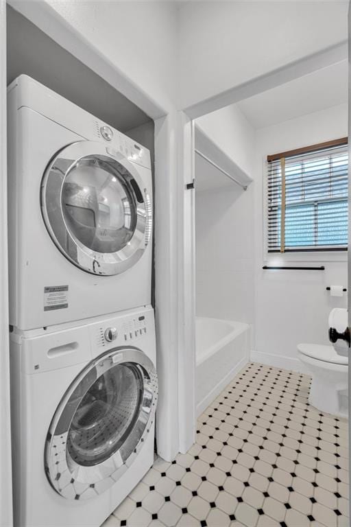 laundry room with stacked washer and dryer