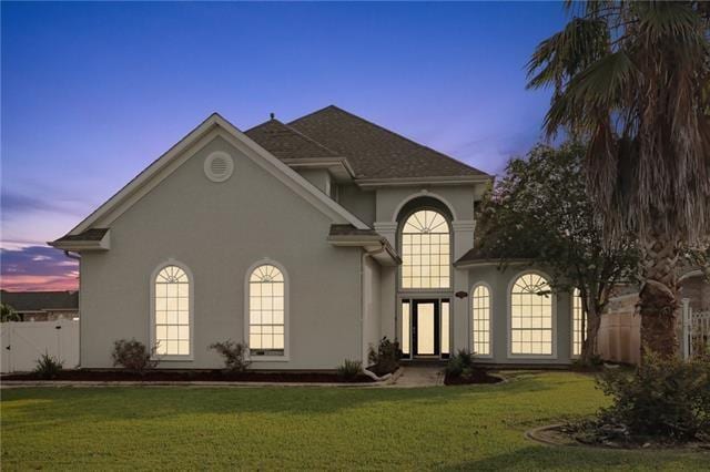 view of front of home with a lawn