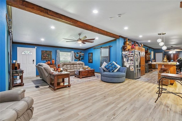 living room featuring beam ceiling, ceiling fan, crown molding, and light wood-type flooring