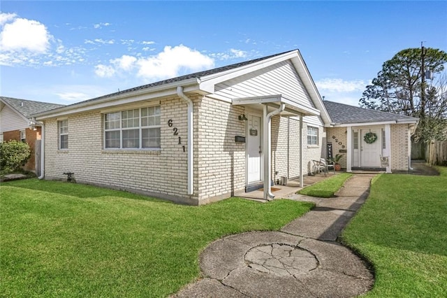 ranch-style home with a front lawn