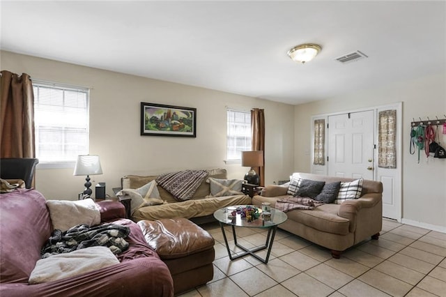 tiled living room featuring plenty of natural light