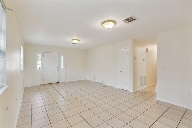 entrance foyer with light tile patterned flooring