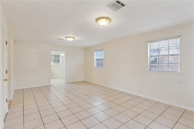 unfurnished room featuring light tile patterned floors