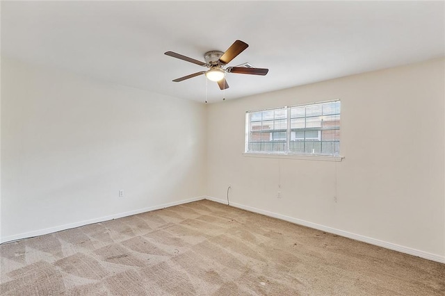 unfurnished room featuring ceiling fan and light colored carpet