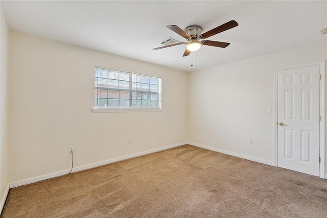 empty room with ceiling fan and carpet flooring