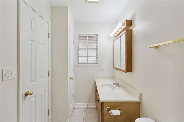 bathroom with tile patterned flooring and vanity