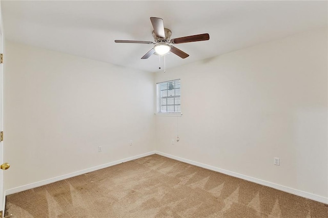 unfurnished room featuring ceiling fan and carpet flooring