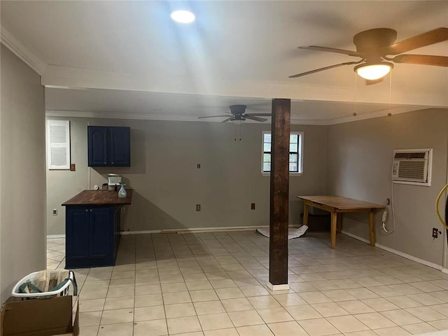 interior space featuring ceiling fan, light tile patterned flooring, crown molding, and an AC wall unit