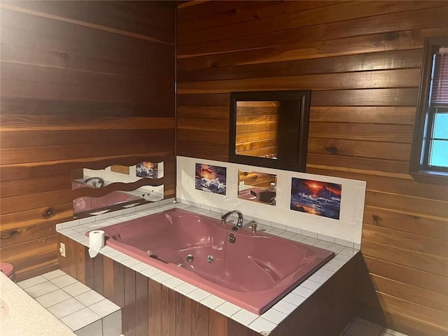 bathroom with wood walls and tiled bath