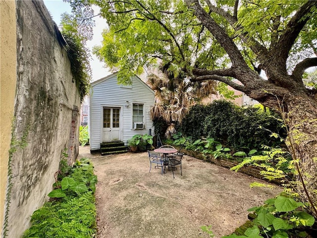 exterior space with cooling unit and a patio area