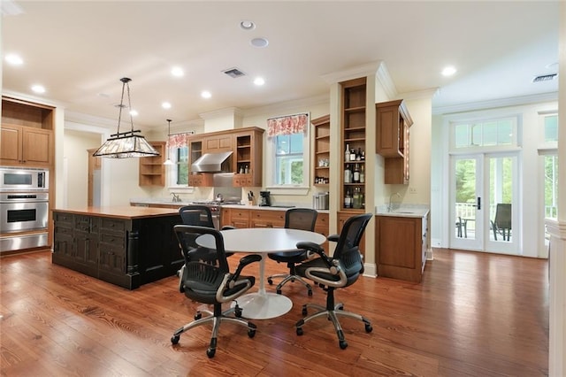 office space featuring french doors, hardwood / wood-style floors, sink, and ornamental molding